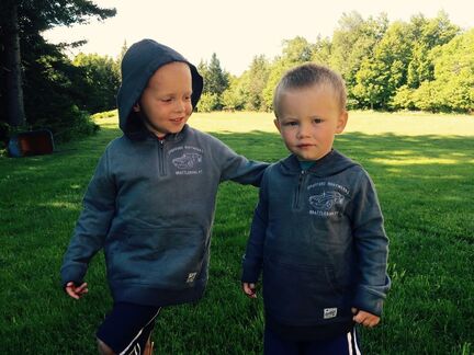 Davey and Chase Twitchell in branded Spofford Bodywerks hoodies